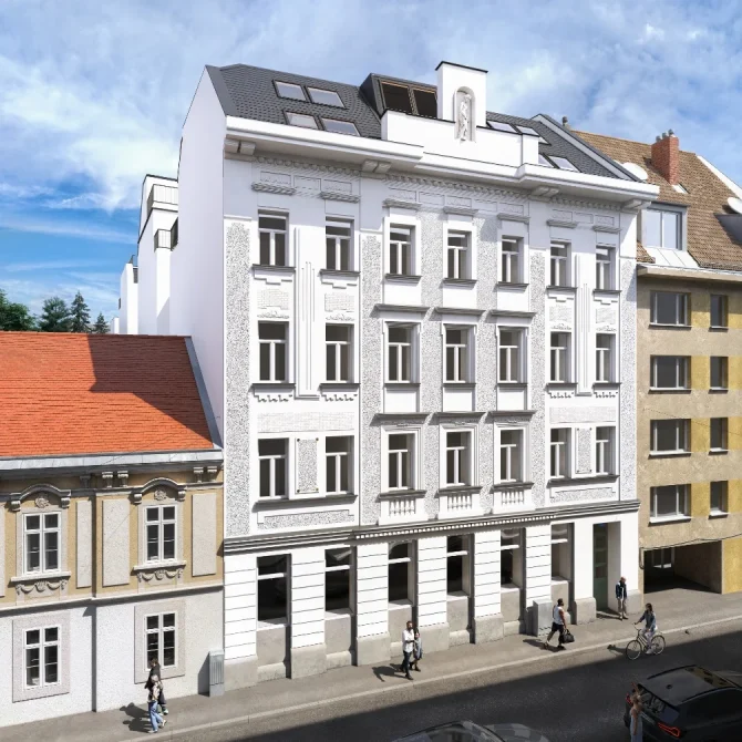 Straßenansicht eines sanierten Altbaus mit moderner Dachausbau-Architektur.